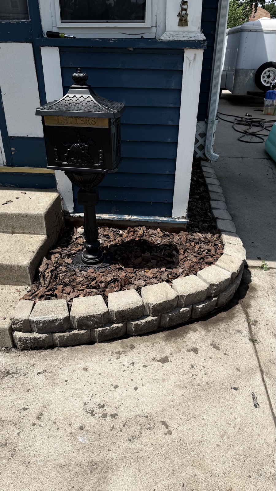 Stone edging and mulch bed — Consider It Done, Sioux Falls