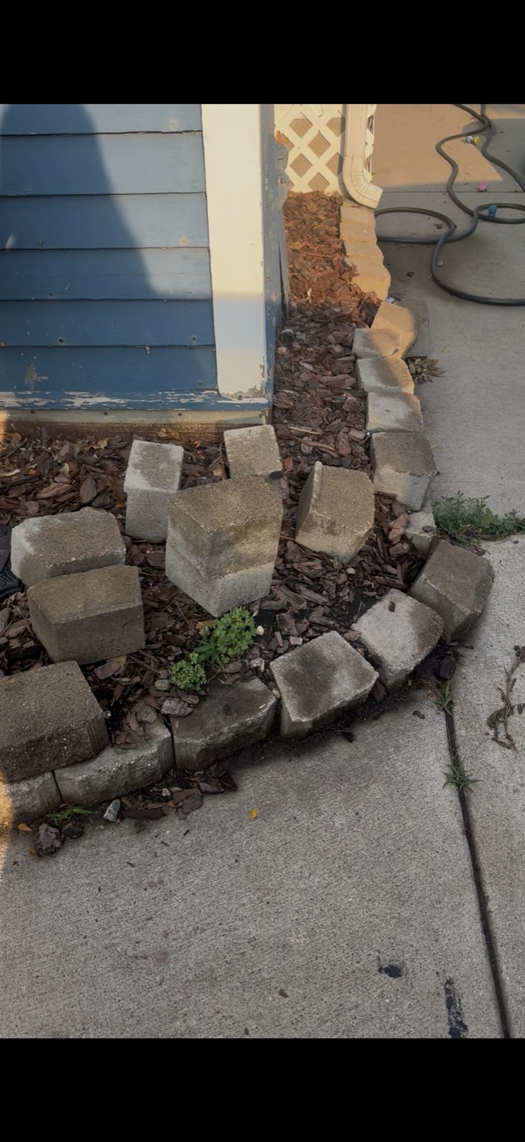Stone edging before — Consider It Done, Sioux Falls
